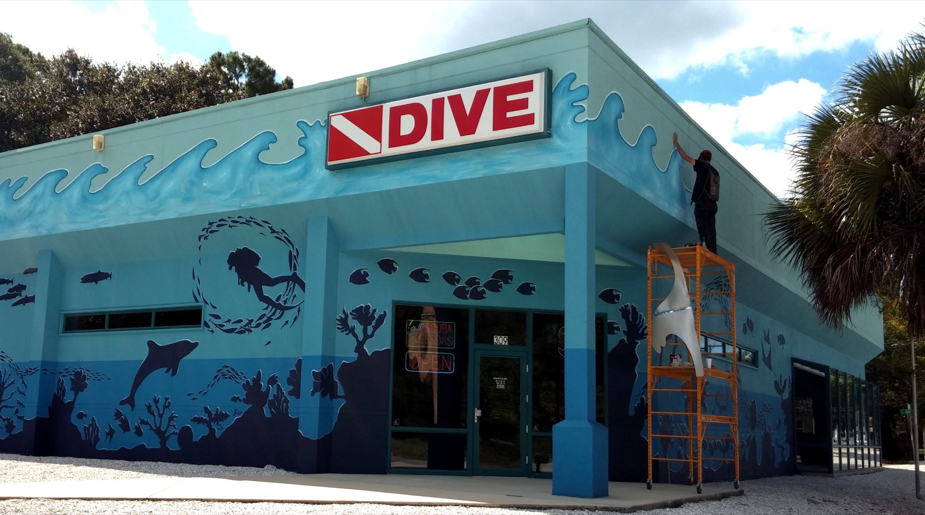 Dive shop exterior with ocean mural